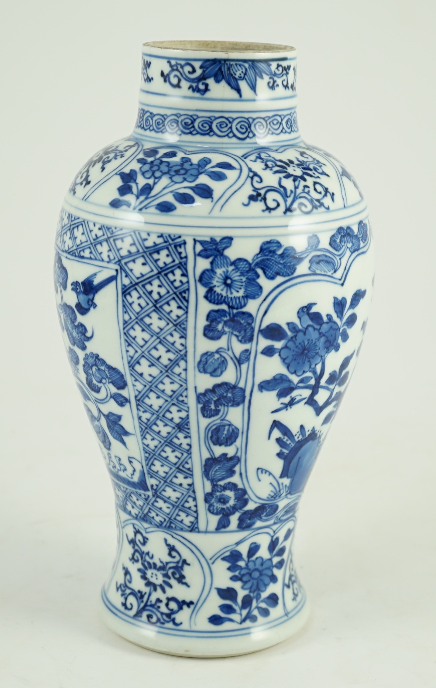 A Chinese blue and white vase, Kangxi period, 21cm high, hairline crack to neck